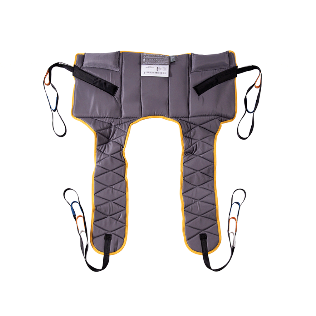 The Joerns Slings for Ascend, Elevate & Journey lifts is a gray padded standing sling with yellow edges, four black straps with colored loops at each corner, an adjustable waist strap, and a top label for use with mobility or transfer lifts.